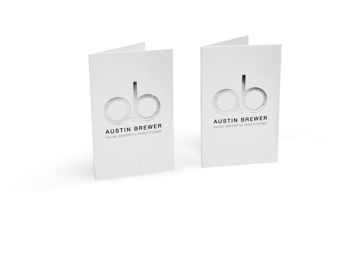 folded business card with metallic logo effect